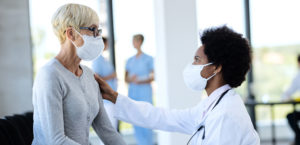 Doctor and patient wearing masks