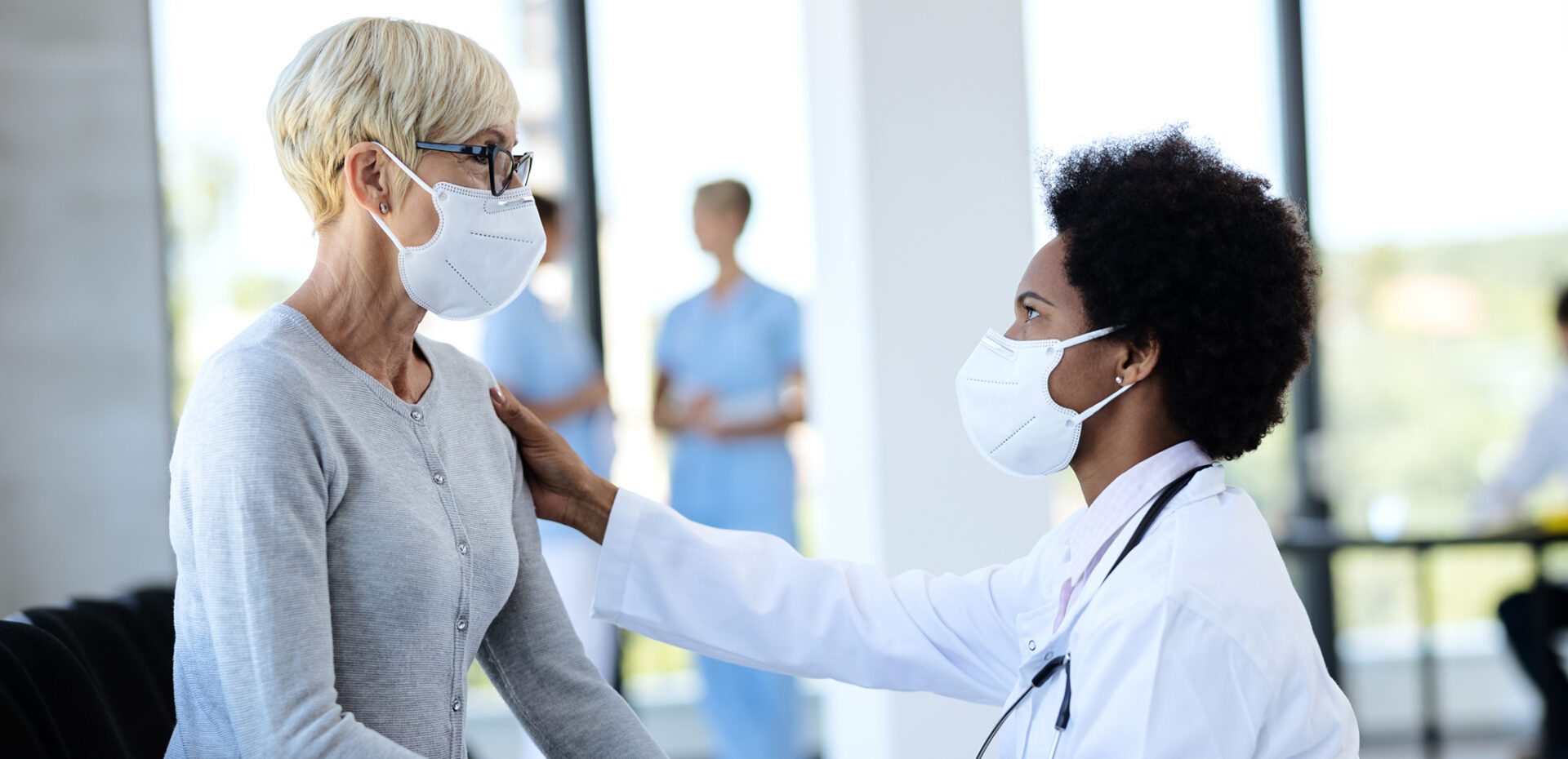 Doctor and patient wearing masks