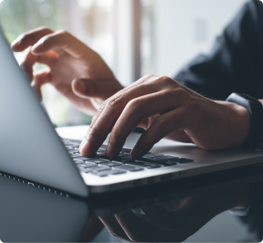 Locum tenens doctor typing on laptop