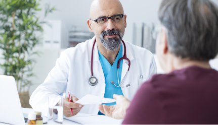 Doctor sitting at desk with patient