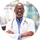 Doctor in white coat with crossed arms