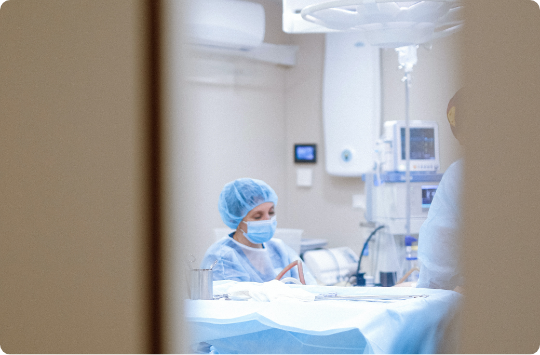 Locum tenens provider wearing scrubs in an operating room