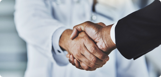 Locum tenens provider and man in suit shaking hands