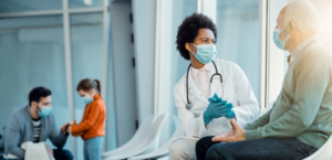 Doctor meeting with patient in lobby