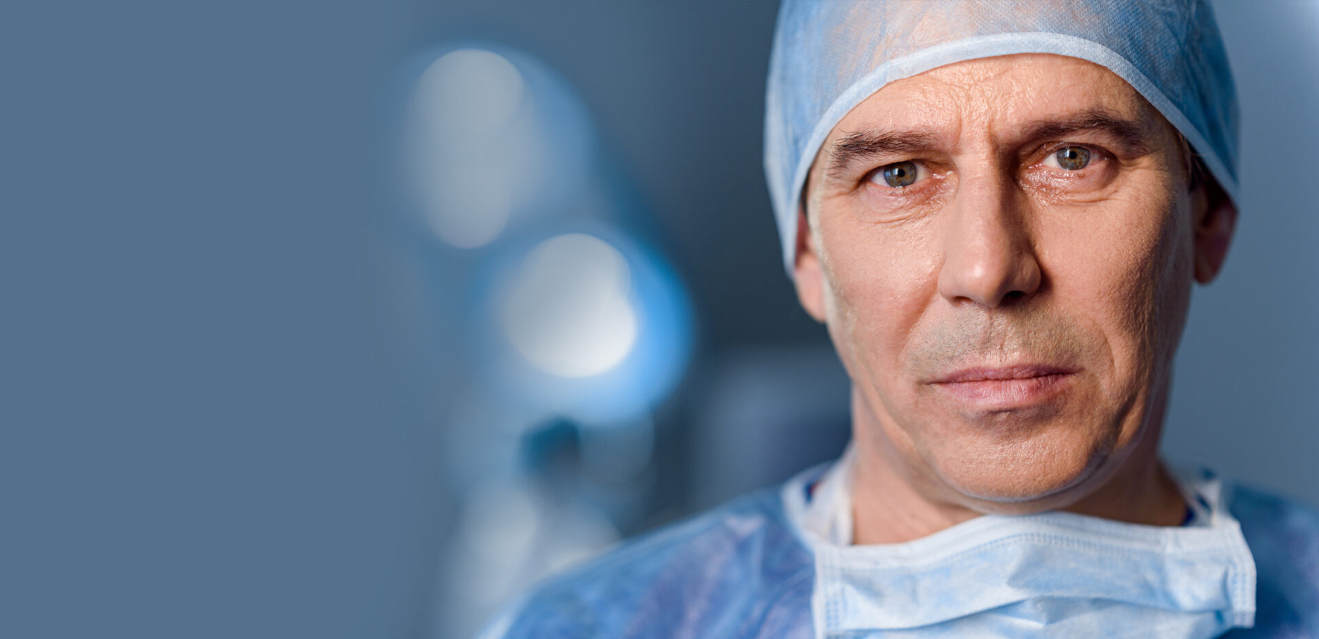 Doctor wearing surgical scrubs and mask