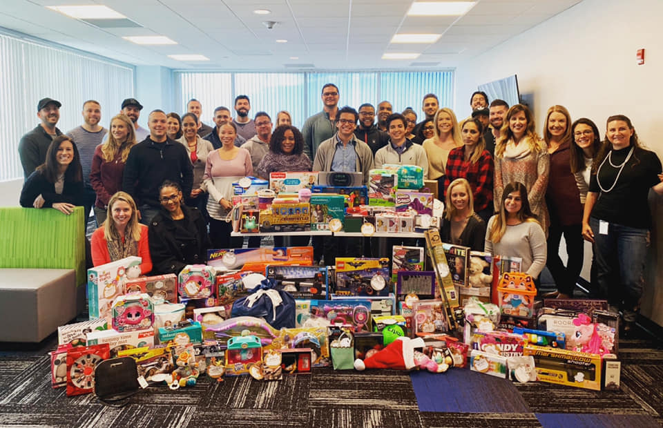 Hayes Locums employees with 4KIDS toy drive collection