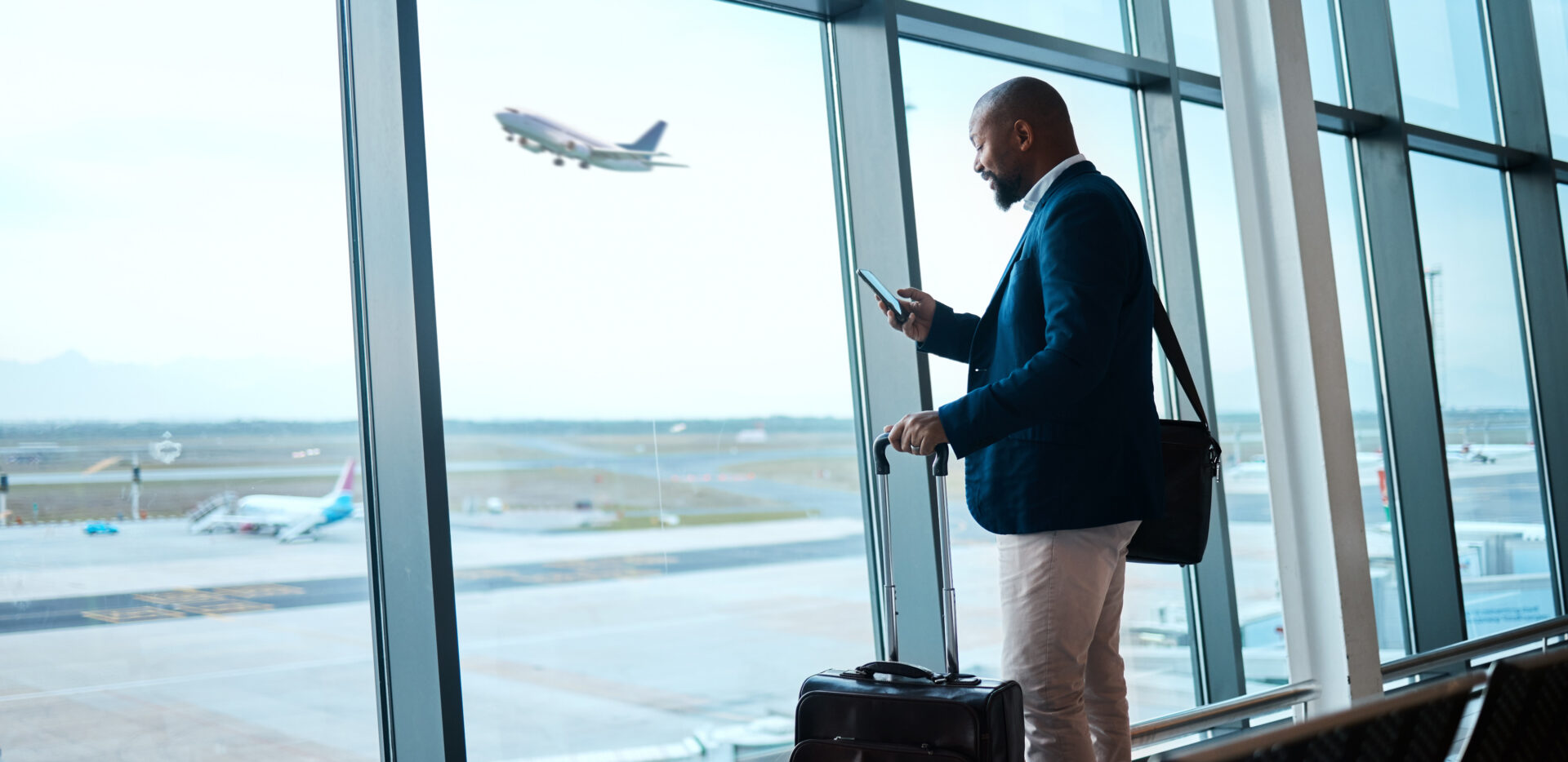Doctor at the airport waiting for his flight.